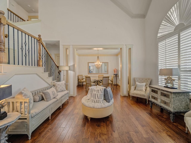 8009 Marathon Dr, Plano, TX 75024 - living area with a chandelier, stairs, hardwood / wood-style floors, crown molding, and a high ceiling