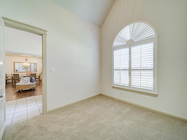 8009 Marathon Dr, Plano, TX 75024 - spare room with a chandelier, carpet floors, and lofted ceiling