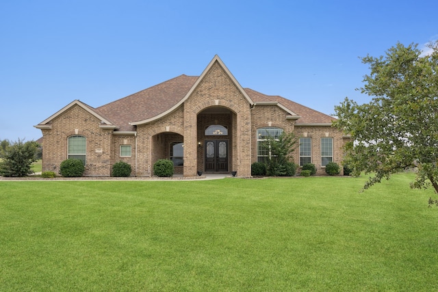 235 Bearclaw Cir, Aledo, TX 76008 - view of front facade featuring brick siding, a front lawn, and roof with shingles