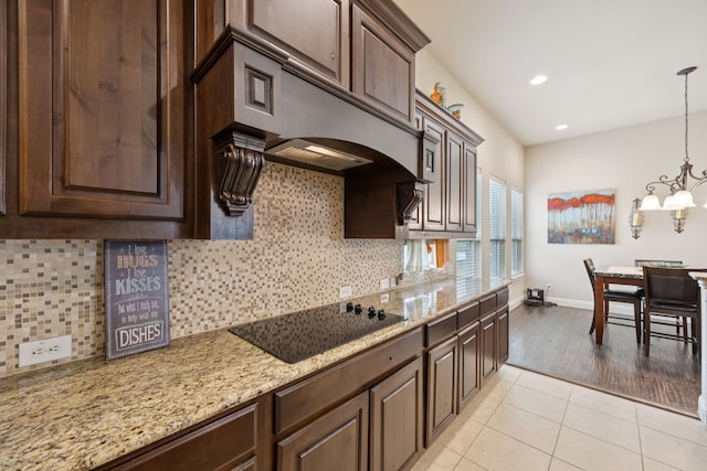 235 Bearclaw Cir, Aledo, TX 76008 - kitchen with black electric stovetop, dark brown cabinets, baseboards, a chandelier, and recessed lighting