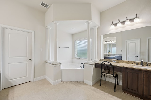 235 Bearclaw Cir, Aledo, TX 76008 - bathroom with decorative columns, a bath, vanity, and tile patterned floors