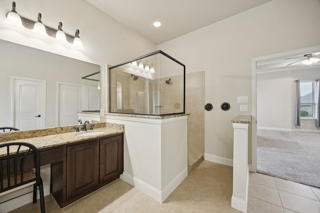235 Bearclaw Cir, Aledo, TX 76008 - bathroom featuring walk in shower, tile patterned flooring, vanity, baseboards, and ceiling fan