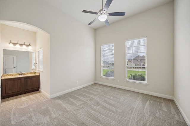 235 Bearclaw Cir, Aledo, TX 76008 - unfurnished bedroom featuring light carpet, multiple windows, a sink, and baseboards