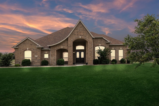235 Bearclaw Cir, Aledo, TX 76008 - french country style house featuring brick siding, a front yard, a shingled roof, and french doors