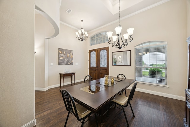 235 Bearclaw Cir, Aledo, TX 76008 - dining area with a chandelier, dark wood-type flooring, baseboards, ornamental molding, and a high ceiling