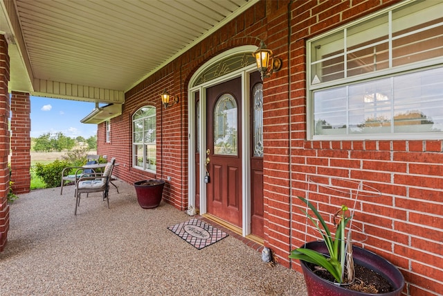 1419 Hinchliffe Rd, Mexia, TX 76667 - doorway to property featuring brick siding and covered porch