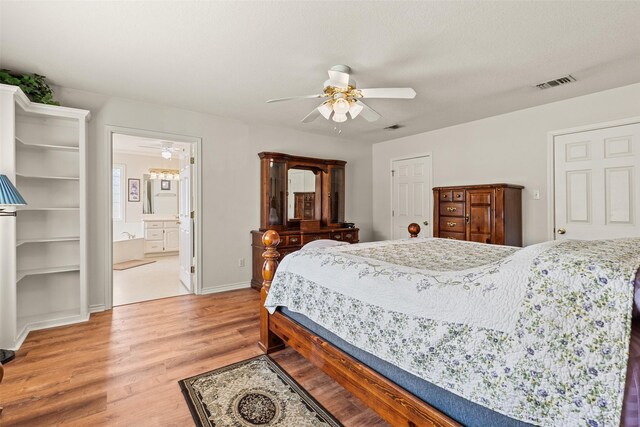 1419 Hinchliffe Rd, Mexia, TX 76667 - bedroom featuring light wood-type flooring, ceiling fan, baseboards, and ensuite bathroom