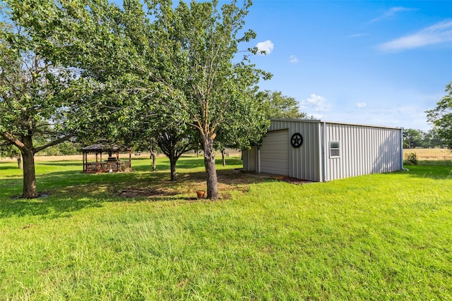 1419 Hinchliffe Rd, Mexia, TX 76667 - view of green lawn featuring a garage, a gazebo, and an outbuilding