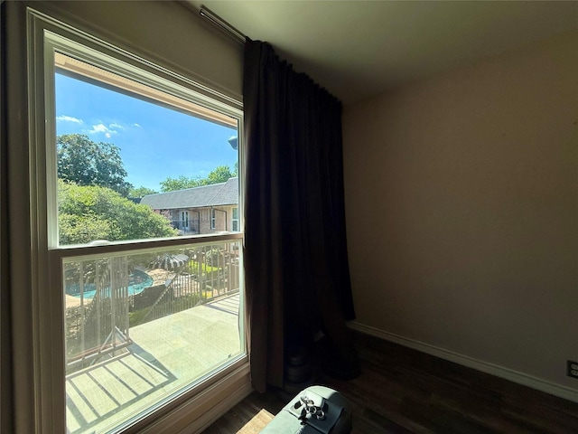 7830 Meadow Park Dr Unit 209, Dallas, TX 75230 - detailed view of wood finished floors and baseboards