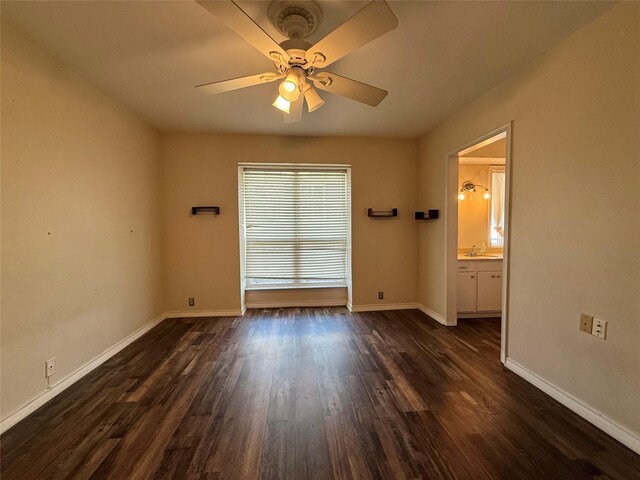 7830 Meadow Park Dr Unit 209, Dallas, TX 75230 - unfurnished room featuring ceiling fan, baseboards, dark wood finished floors, and a sink