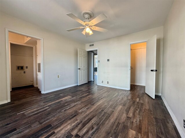 7830 Meadow Park Dr Unit 209, Dallas, TX 75230 - unfurnished bedroom with dark wood-type flooring, baseboards, and a ceiling fan