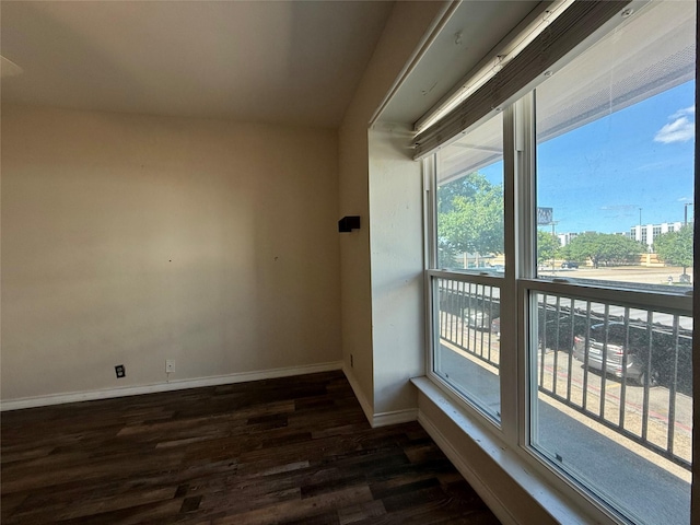 7830 Meadow Park Dr Unit 209, Dallas, TX 75230 - spare room with dark wood-style flooring and baseboards