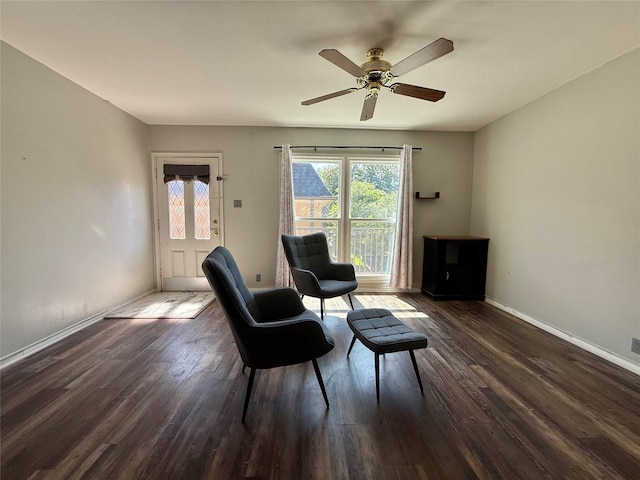 7830 Meadow Park Dr Unit 209, Dallas, TX 75230 - living area featuring dark wood finished floors, a ceiling fan, and baseboards