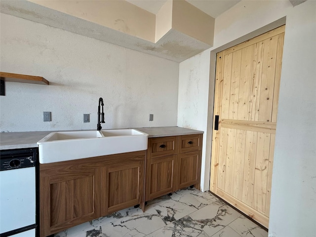 7830 Meadow Park Dr Unit 209, Dallas, TX 75230 - kitchen featuring dishwashing machine, a sink, brown cabinets, light marble finish flooring, and light countertops