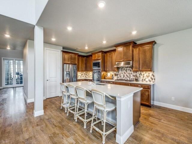720 Lawndale St, Celina, TX 75009 - living room with ceiling fan, a high ceiling, washer and dryer, a chandelier, and wood finished floors