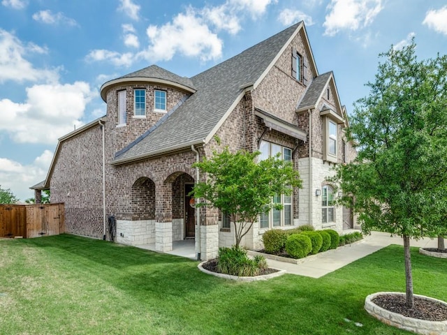 720 Lawndale St, Celina, TX 75009 - view of front of home featuring a shingled roof and brick siding