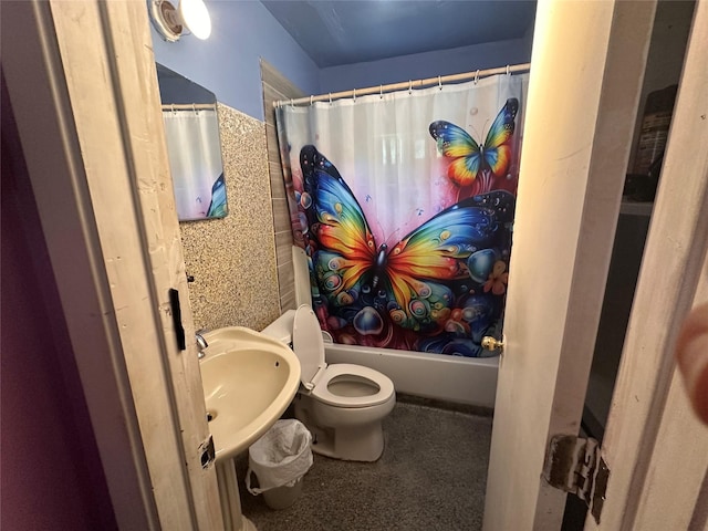 129 E Wanda Dr, Garland, TX 75040 - full bathroom featuring toilet, shower / tub combo with curtain, and a sink