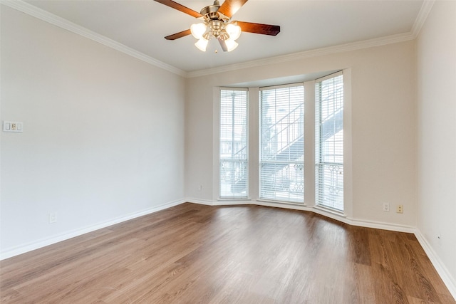 3208 Cole Ave Unit 2203, Dallas, TX 75204 - empty room featuring crown molding, wood finished floors, a ceiling fan, and baseboards