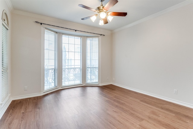 3208 Cole Ave Unit 2203, Dallas, TX 75204 - empty room featuring wood finished floors, ornamental molding, ceiling fan, and baseboards