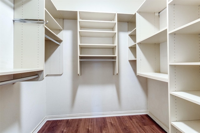 3208 Cole Ave Unit 2203, Dallas, TX 75204 - walk in closet featuring wood finished floors