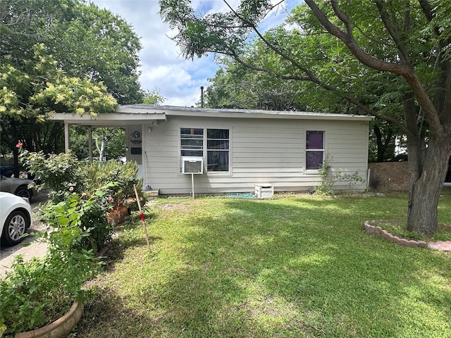 133 E Wanda Dr, Garland, TX 75040 - back of property with a lawn and cooling unit