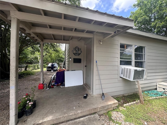 133 E Wanda Dr, Garland, TX 75040 - view of patio featuring cooling unit and a carport