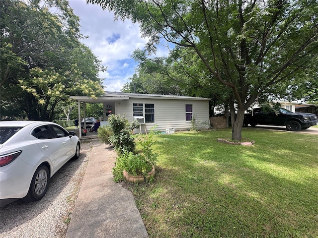 133 E Wanda Dr, Garland, TX 75040 - manufactured / mobile home featuring driveway, a front lawn, and a carport
