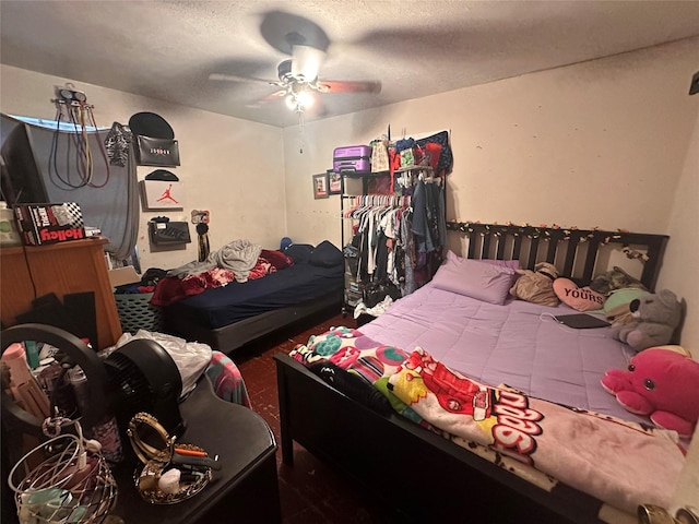133 E Wanda Dr, Garland, TX 75040 - bedroom with ceiling fan and a textured ceiling