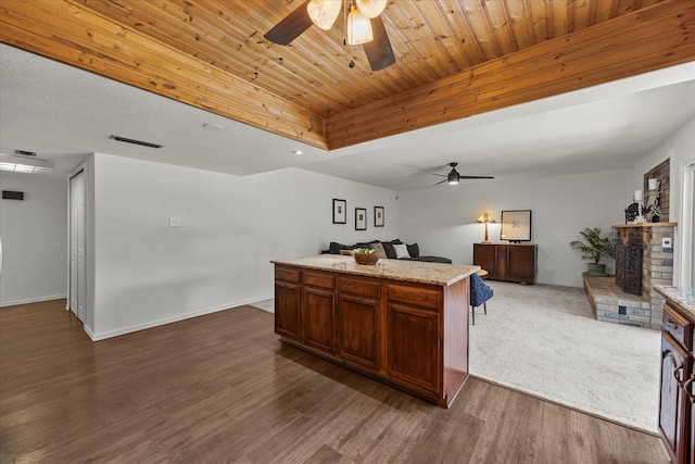 4208 Crestover Dr, Mesquite, TX 75150 - kitchen with a ceiling fan, open floor plan, a fireplace, a center island, and dark wood-style floors