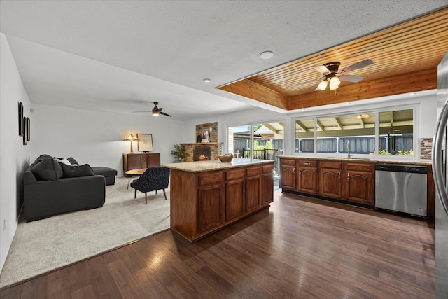 4208 Crestover Dr, Mesquite, TX 75150 - kitchen with a ceiling fan, dishwasher, dark wood-type flooring, and a fireplace