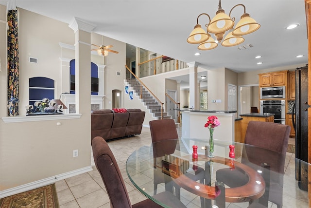 730 Pheasant Run Dr, Murphy, TX 75094 - dining space with decorative columns, a chandelier, light tile patterned floors, a ceiling fan, and recessed lighting