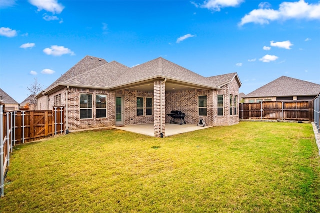 2705 Cumberland, The Colony, TX 75056 - back of property with brick siding, roof with shingles, a patio area, and a gate