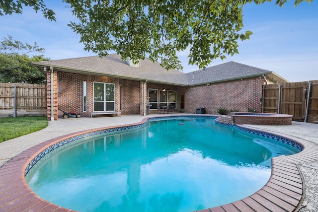2401 Fountain Head Dr, Plano, TX 75023 - view of swimming pool featuring a patio area, a fenced backyard, and a pool with connected hot tub