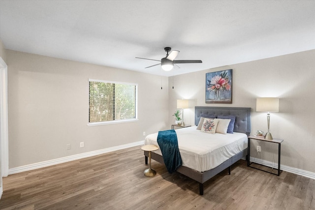 7817 Whirlwind Dr, Fort Worth, TX 76133 - bedroom featuring baseboards, wood finished floors, and a ceiling fan