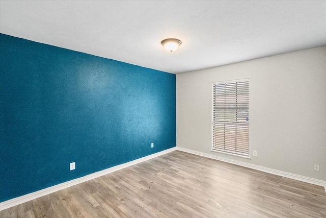 7817 Whirlwind Dr, Fort Worth, TX 76133 - spare room featuring wood finished floors and baseboards