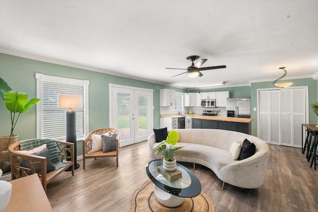 7817 Whirlwind Dr, Fort Worth, TX 76133 - living room with ornamental molding, french doors, wood finished floors, and ceiling fan