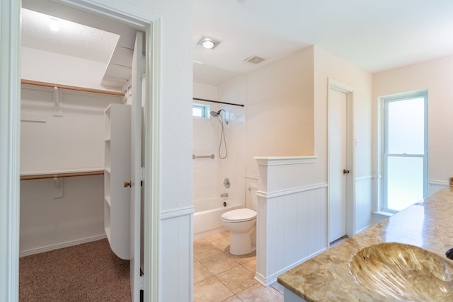110 Sunview St, Sunnyvale, TX 75182 - bathroom with vanity, shower / bathtub combination, toilet, tile patterned floors, and a walk in closet