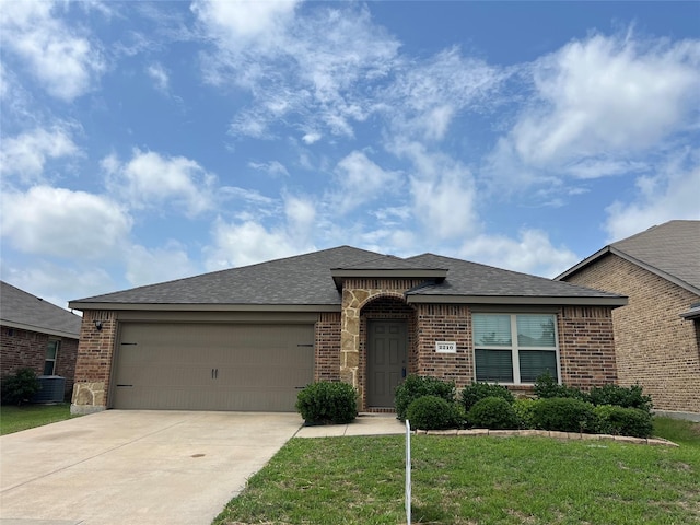 2210 Tombstone Dr, Forney, TX 75126 - view of front facade featuring brick siding, concrete driveway, an attached garage, and a front lawn