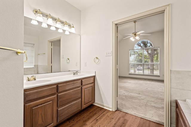 3559 Kayewood Dr, Little Elm, TX 75068 - bathroom with double vanity, ceiling fan, and wood finished floors