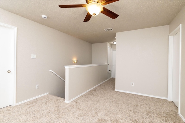 2133 Bliss Rd, Fort Worth, TX 76177 - carpeted empty room with ceiling fan, a smoke detector, baseboards, and a textured ceiling
