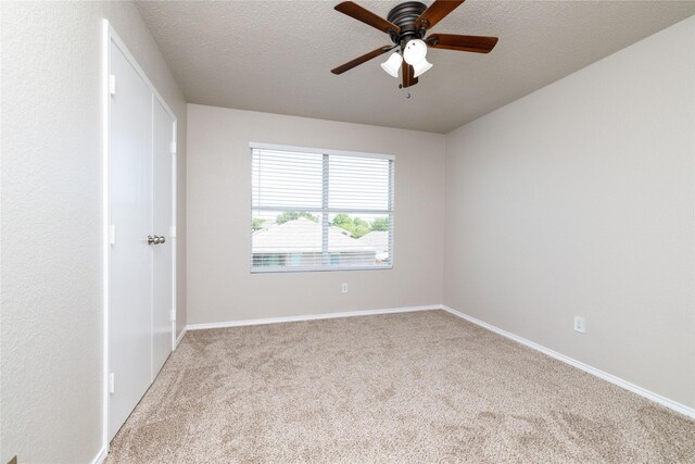 2133 Bliss Rd, Fort Worth, TX 76177 - carpeted spare room with a ceiling fan, a textured ceiling, and baseboards