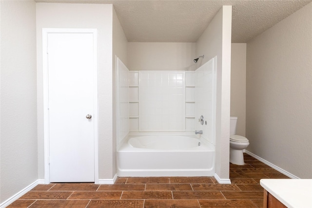 2133 Bliss Rd, Fort Worth, TX 76177 - bathroom featuring toilet, tub / shower combination, vanity, a textured ceiling, and baseboards