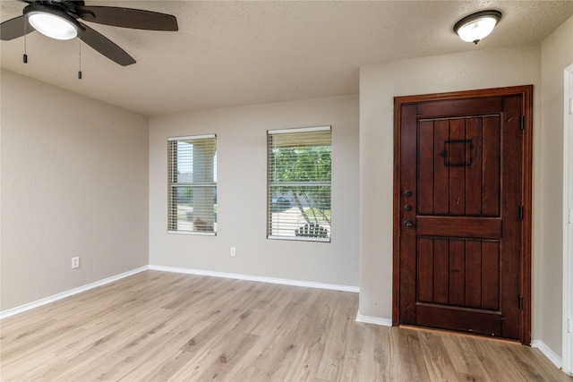 2133 Bliss Rd, Fort Worth, TX 76177 - foyer entrance featuring light wood-style flooring, a ceiling fan, and baseboards