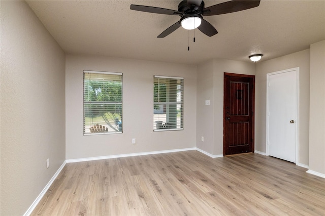 2133 Bliss Rd, Fort Worth, TX 76177 - spare room with light wood-style flooring, a ceiling fan, and baseboards