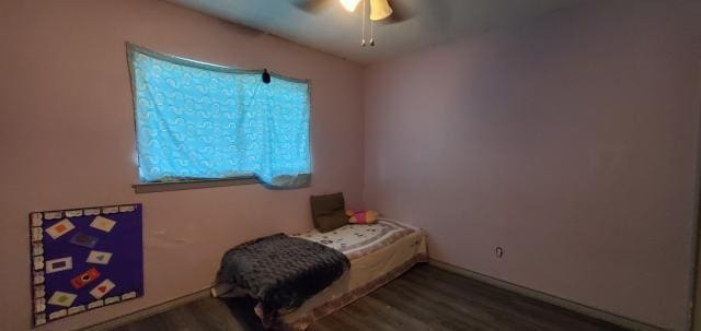 918 Greenbriar Dr, Garland, TX 75043 - bedroom featuring wood finished floors, ceiling fan, and baseboards