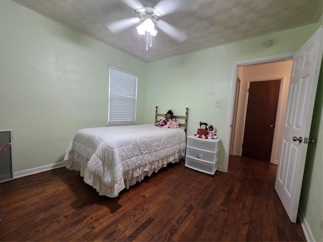 212 W 7th St, Lancaster, TX 75146 - bedroom featuring wood finished floors, baseboards, and ceiling fan