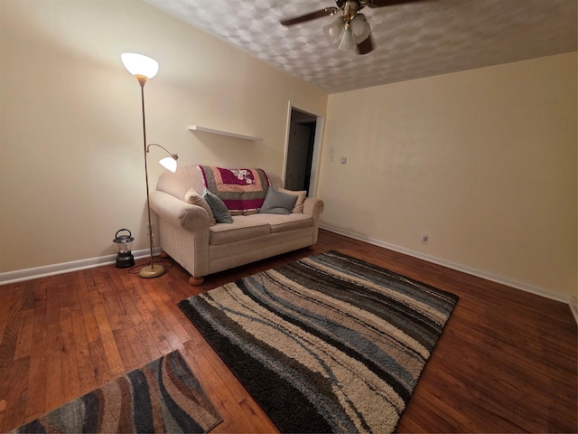 212 W 7th St, Lancaster, TX 75146 - living area with ceiling fan, wood finished floors, a textured ceiling, and baseboards