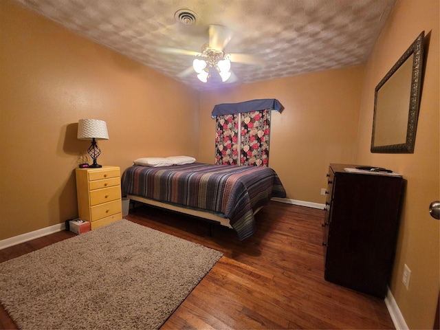 212 W 7th St, Lancaster, TX 75146 - bedroom featuring baseboards, wood finished floors, ceiling fan, and a textured ceiling