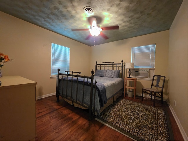 212 W 7th St, Lancaster, TX 75146 - bedroom featuring wood finished floors, baseboards, cooling unit, and ceiling fan