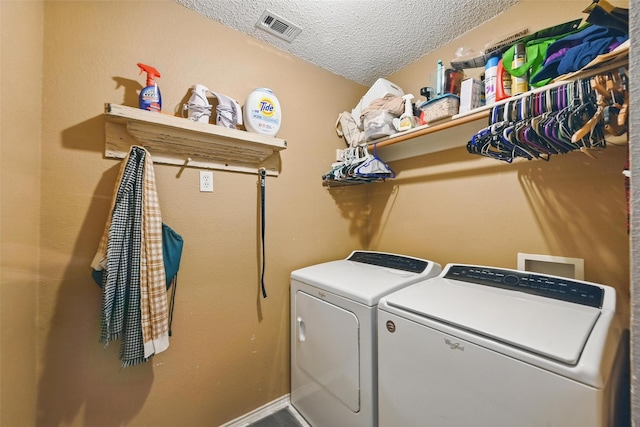 2748 Yoakum St, Fort Worth, TX 76108 - laundry area with washer and dryer and a textured ceiling